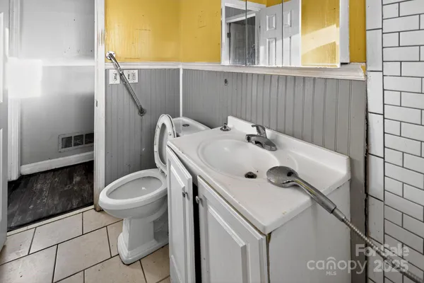 a bathroom with a sink and toilet