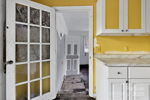 a view of a bathroom with a sink and a window