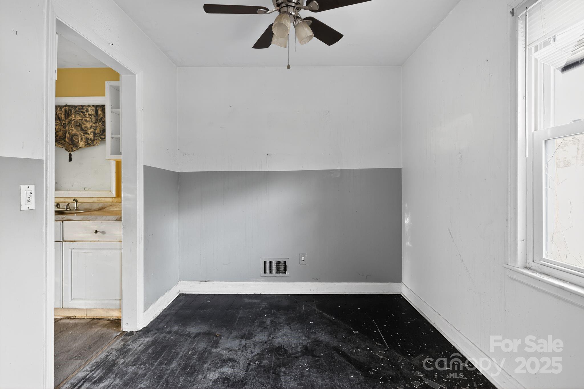 3116 Truman Street Columbia, SC 29204 - Photo 6 of 34 wooden floor in an empty room with a window