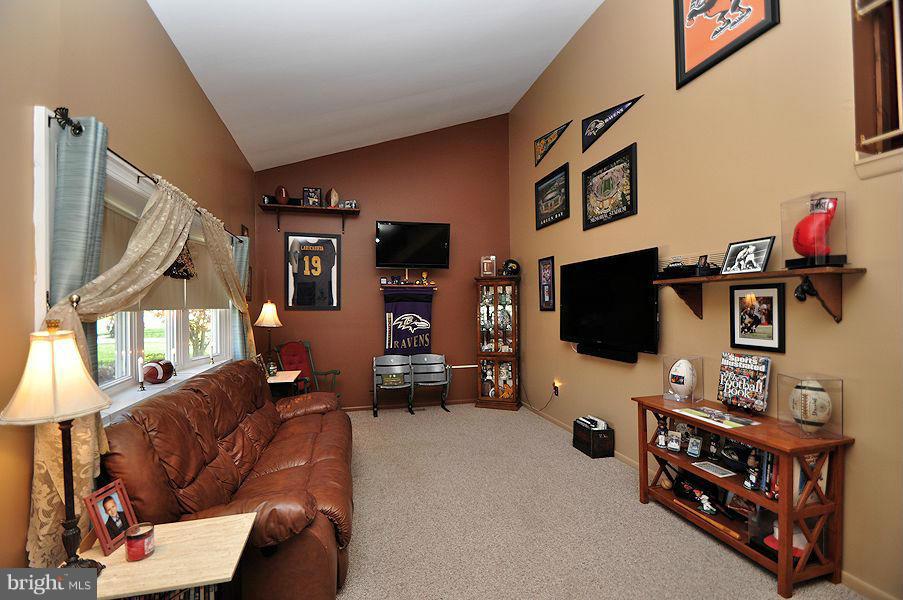4813 Vicky Road Baltimore, MD 21236 - Photo 2 of 22 a living room with furniture and a flat screen tv