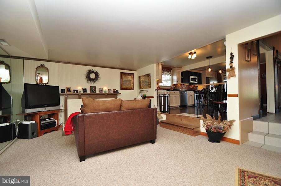 4813 Vicky Road Baltimore, MD 21236 - Photo 11 of 22 a living room with furniture and a flat screen tv