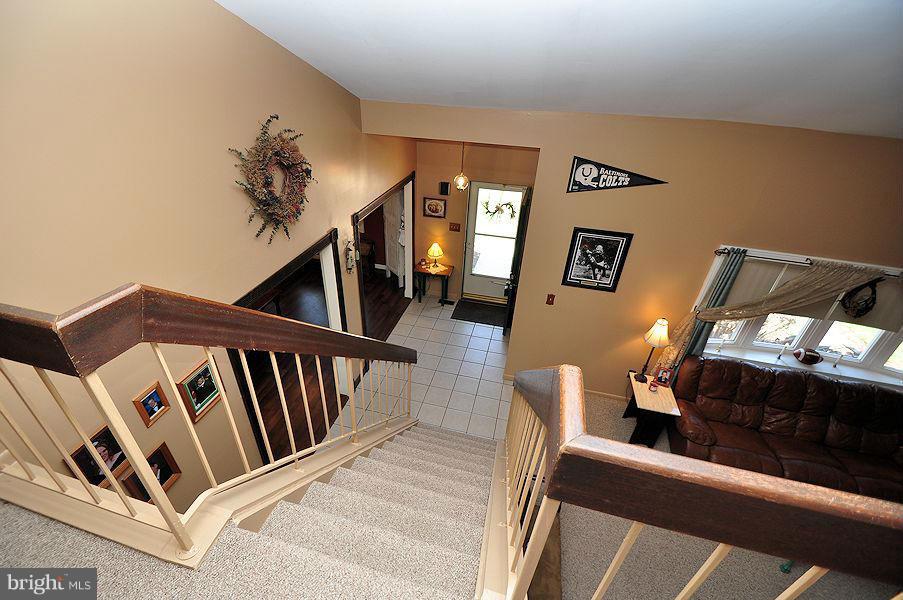 4813 Vicky Road Baltimore, MD 21236 - Photo 14 of 22 a view of a livingroom with furniture and staircase