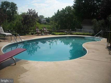 4813 Vicky Road Baltimore, MD 21236 - Photo 22 of 22 a view of a swimming pool with outdoor seating and plants