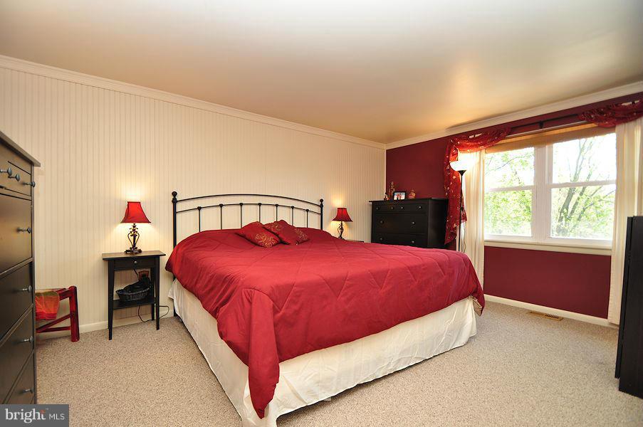 4813 Vicky Road Baltimore, MD 21236 - Photo 4 of 22 a bedroom with a bed and a window