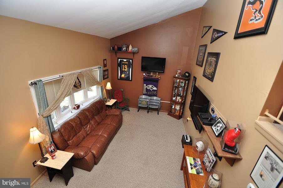 4813 Vicky Road Baltimore, MD 21236 - Photo 6 of 22 a living room with furniture and a flat screen tv