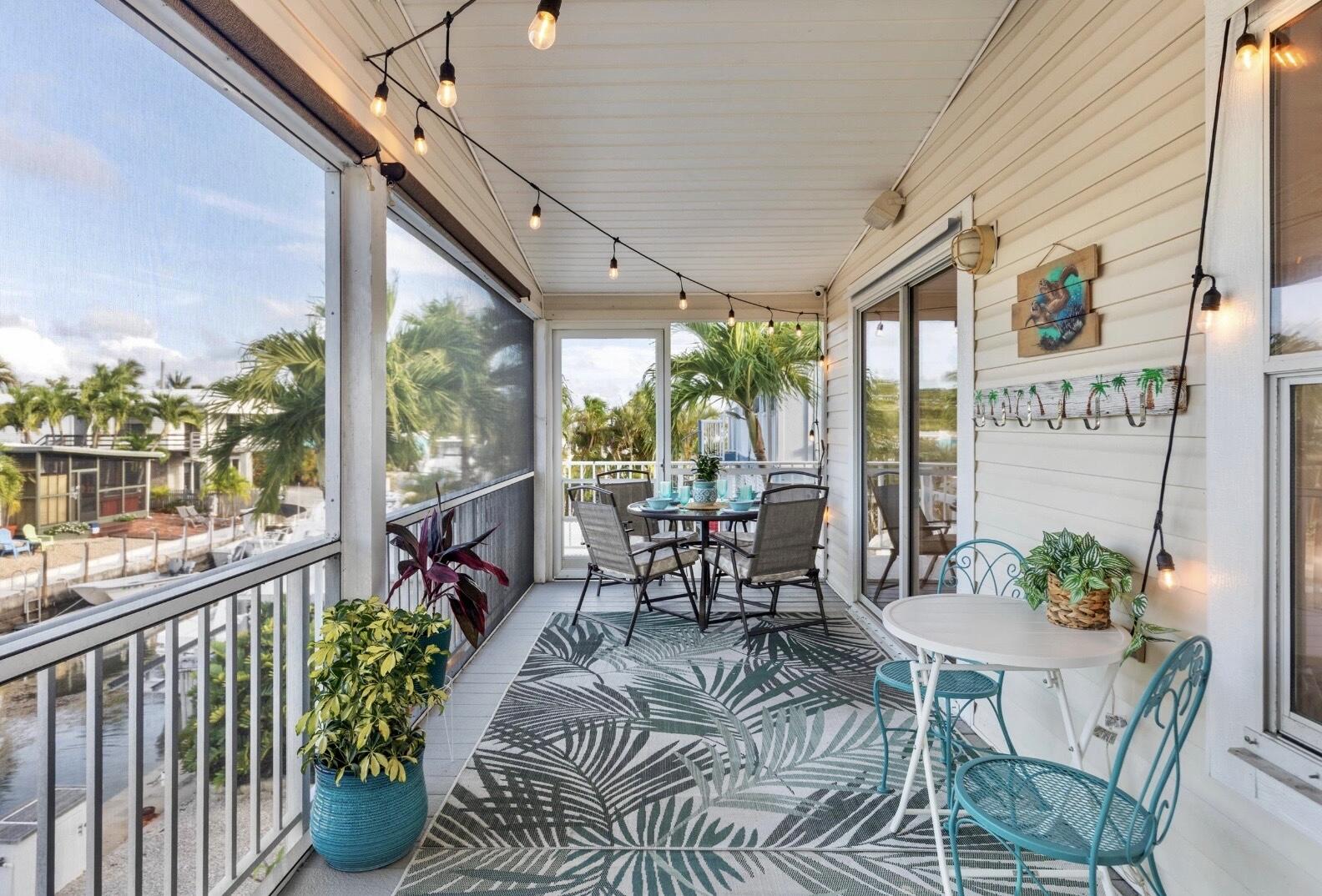 157 Mars Lane Key West, FL 33040 - Photo 6 of 41 a view of a dining room with furniture window and outside view