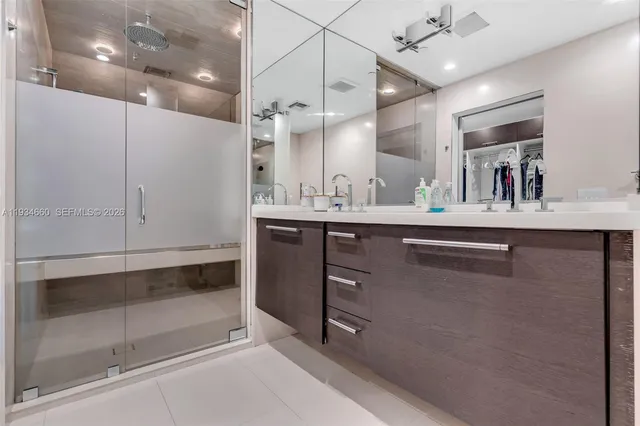 a city view from a balcony with outdoor seating