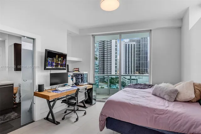 a view of a balcony with two chairs and a table