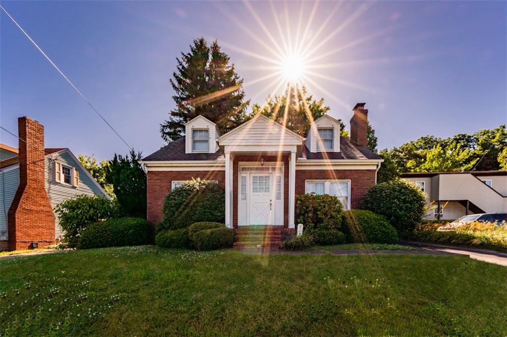 707 South 6th Street Indiana, PA 15701 - Photo 1 of 16 a front view of a house with a garden