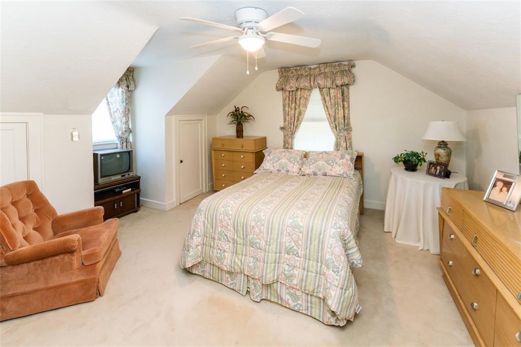 707 South 6th Street Indiana, PA 15701 - Photo 8 of 16 a spacious bedroom with a bed and a couch