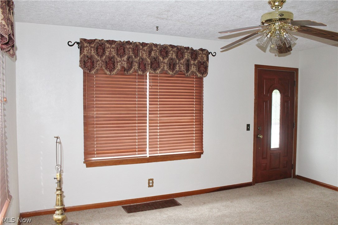 4885 Arbor Road Southwest Canton, OH 44710 - Photo 3 of 15 Carpeted Living Room, all window treatments convey.