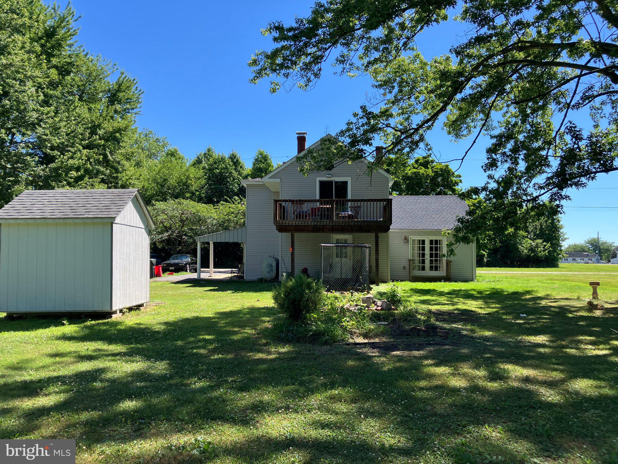 4818 Piney Neck Road Rock Hall, MD 21661 - Photo 23 of 24 a view of a house with a backyard