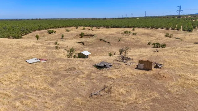 a view of wooden house with a yard