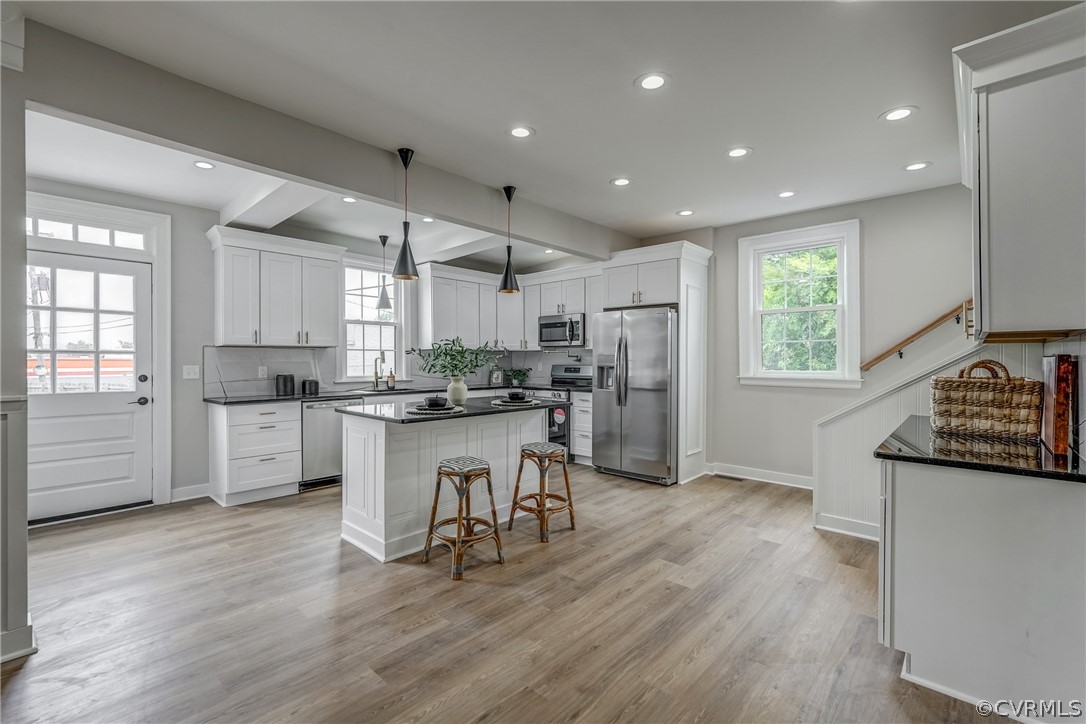 811 Overbrook Road Richmond, VA 23222 - Photo 15 of 50 Kitchen featuring white cabinetry, decorative ligh