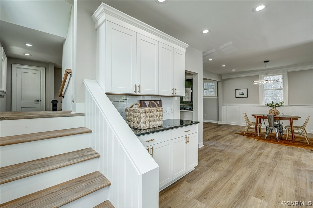 811 Overbrook Road Richmond, VA 23222 - Photo 21 of 50 Stairway with a notable chandelier and light hardw
