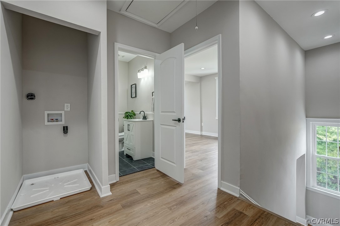 811 Overbrook Road Richmond, VA 23222 - Photo 24 of 50 Corridor featuring wood-type flooring and sink