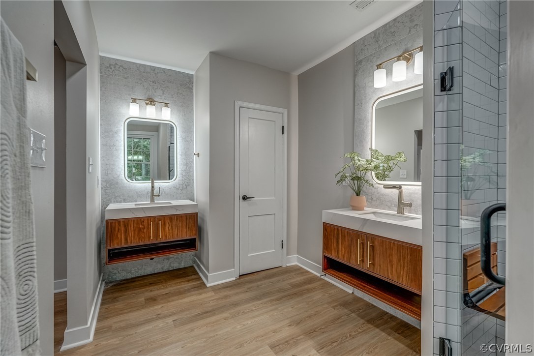 811 Overbrook Road Richmond, VA 23222 - Photo 36 of 50 Bathroom featuring tile walls, wood-type flooring,