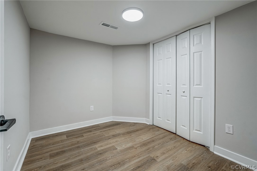 811 Overbrook Road Richmond, VA 23222 - Photo 43 of 50 Unfurnished bedroom with a closet and wood-type fl