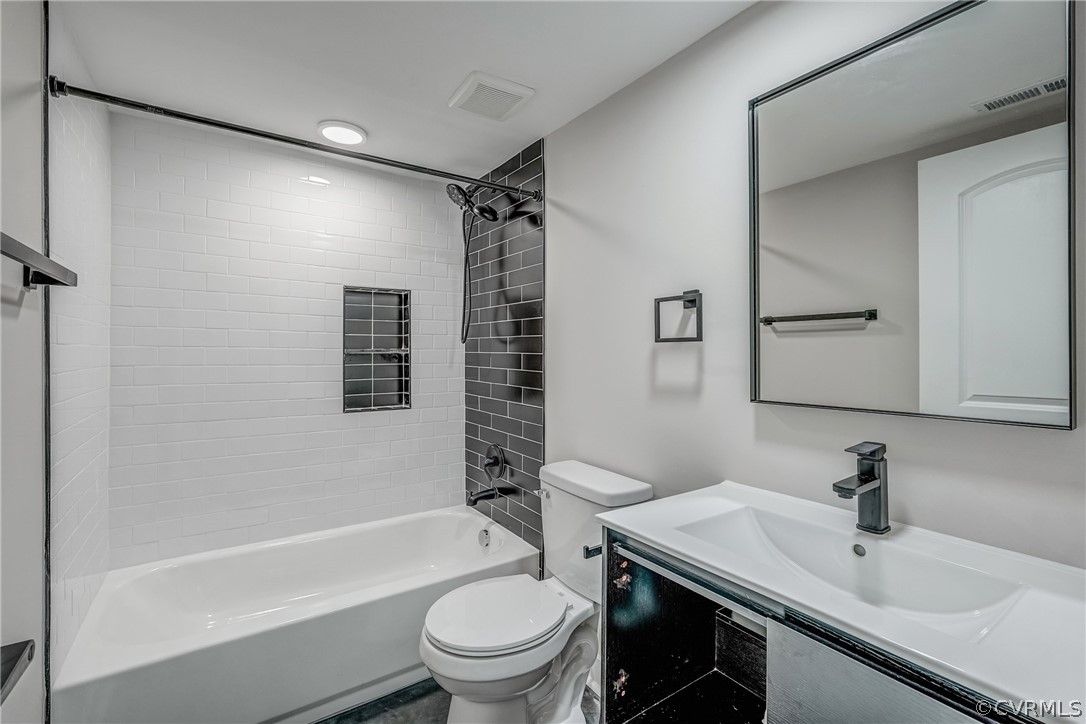 811 Overbrook Road Richmond, VA 23222 - Photo 44 of 50 Full bathroom with vanity, toilet, and tiled showe