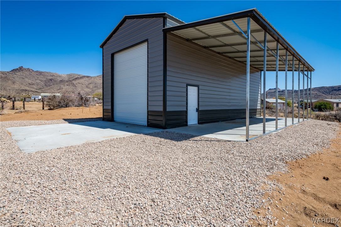 3592 Bouse Road Golden Valley, AZ 86413 - Photo 6 of 10 a backyard of a house