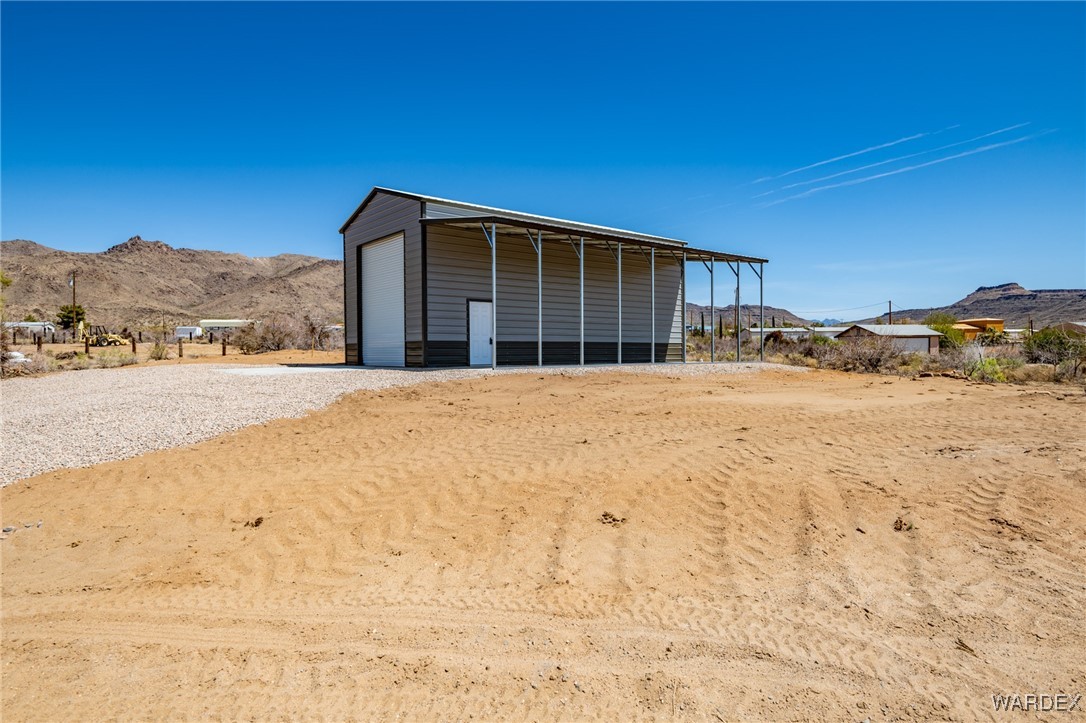 3592 Bouse Road Golden Valley, AZ 86413 - Photo 8 of 10 a large house with a mountain view