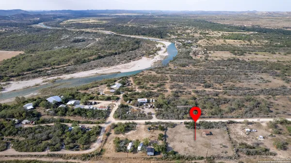 an aerial view of residential house and tree