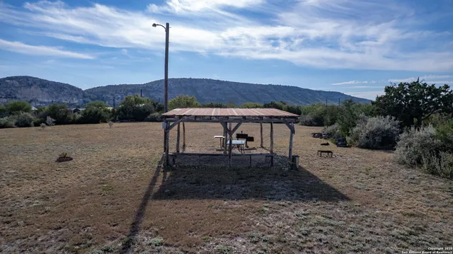 a view of a large yard with lots of green space
