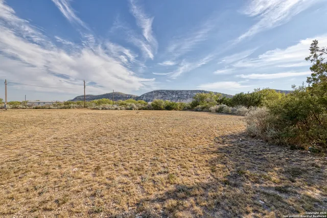 a view of a lake with houses in the back