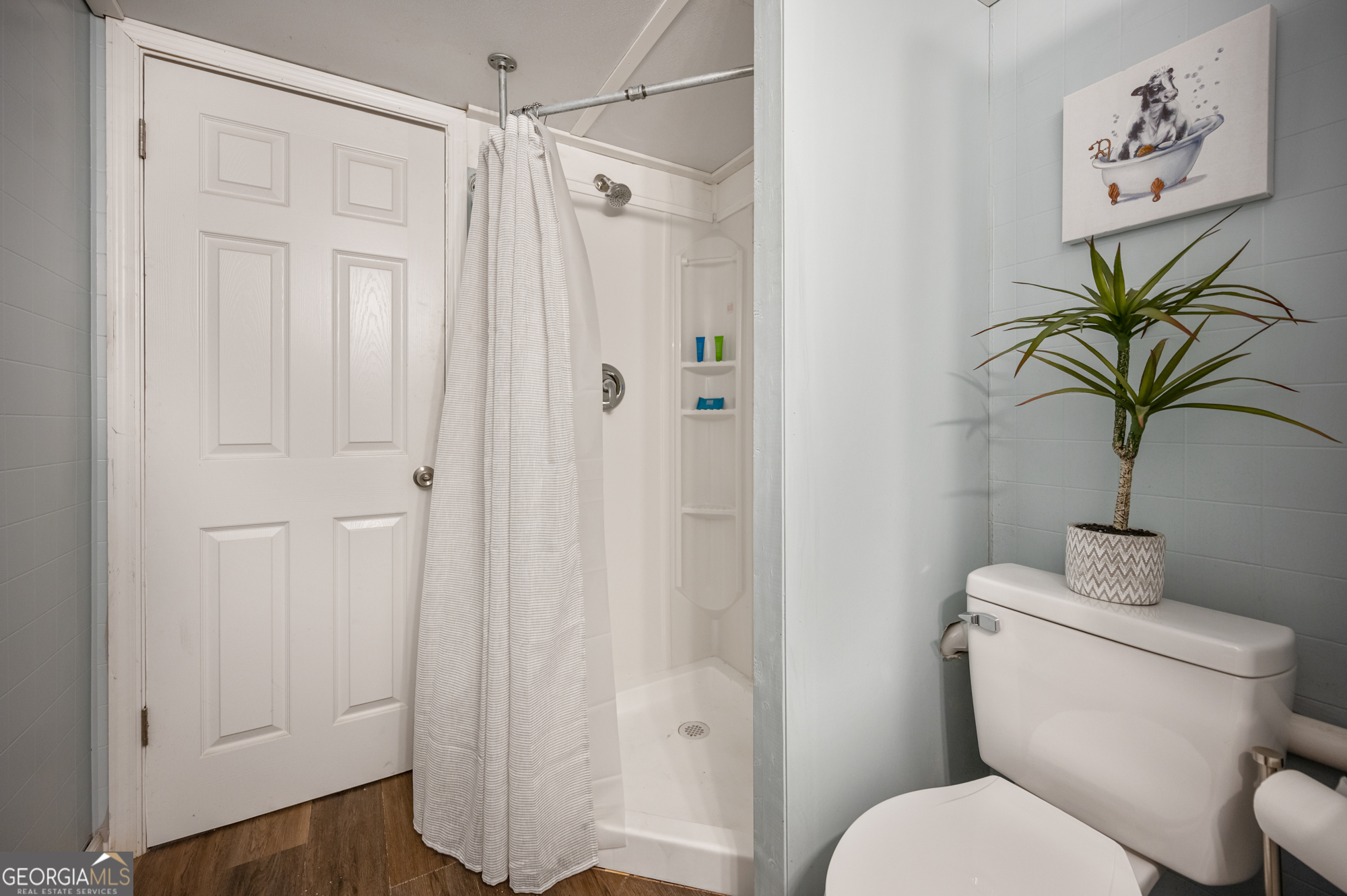 4297 Earney Road Woodstock, GA 30188 - Photo 11 of 35 a white toilet sitting next to a bathroom