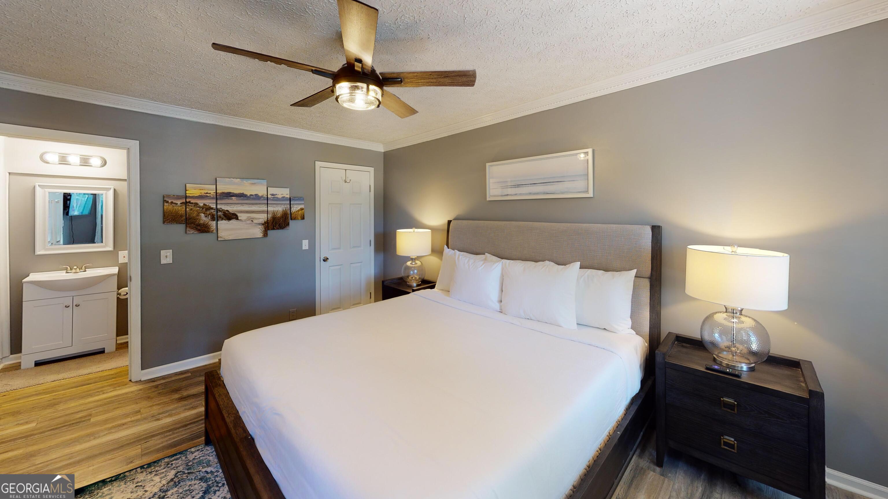 4297 Earney Road Woodstock, GA 30188 - Photo 29 of 35 a bedroom with a bed and a view of bathroom