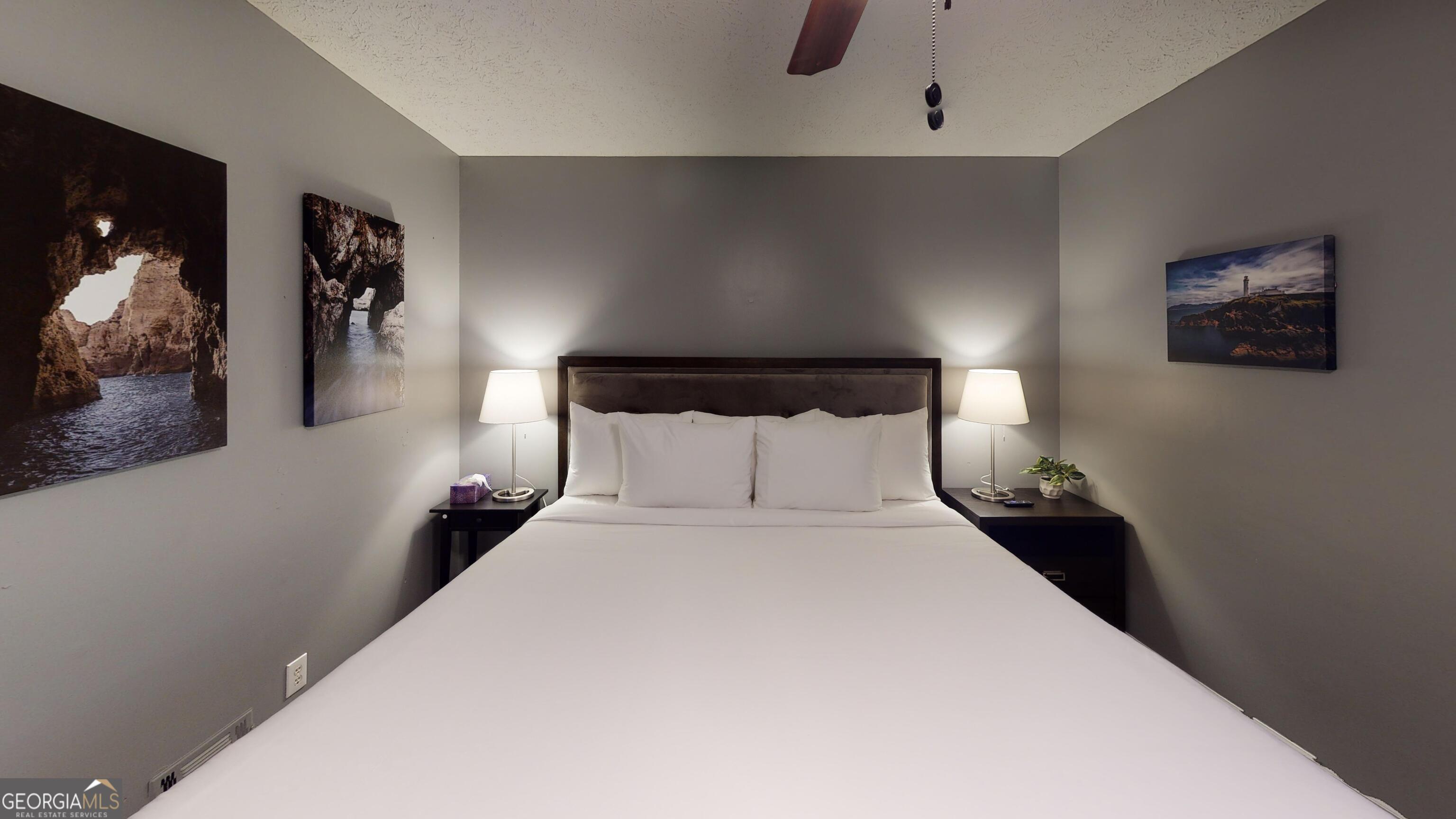 4297 Earney Road Woodstock, GA 30188 - Photo 30 of 35 a bed room with a bed and a night stand