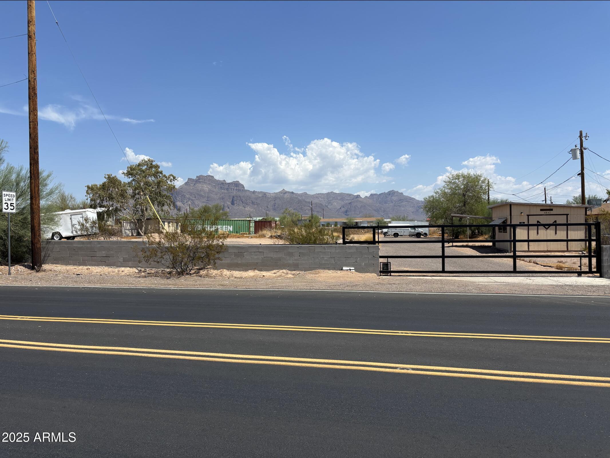 685 South Tomahawk Road Apache Junction, AZ 85119 - Photo 1 of 15 a view of a water fountain and a big yard