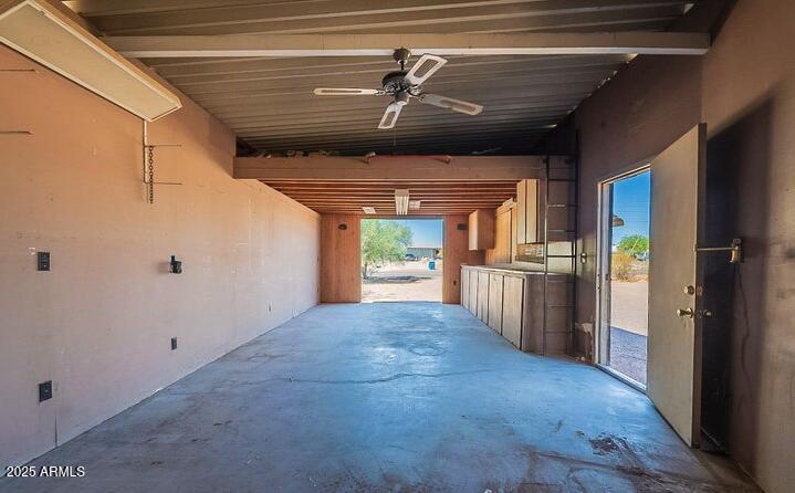 685 South Tomahawk Road Apache Junction, AZ 85119 - Photo 12 of 15 a view of a hallway with wooden floor and a kitchen