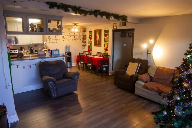 a living room with furniture and a large window