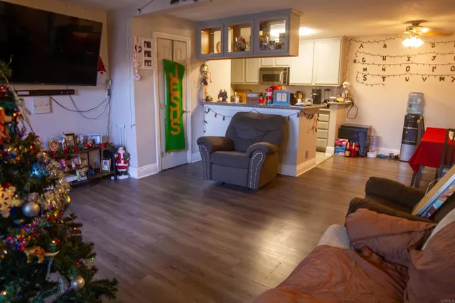 a living room with furniture and a flat screen tv