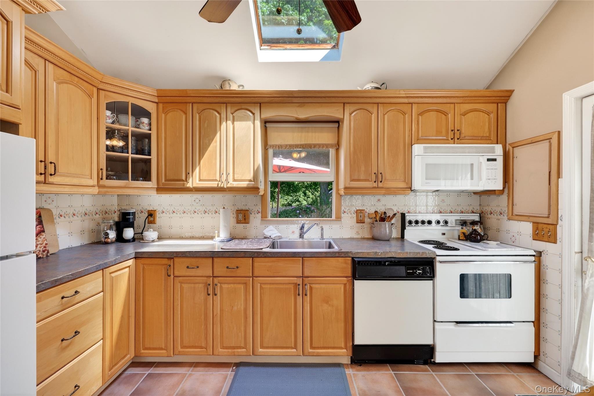 232 Cherry Road Yorktown Heights, NY 10598 - Photo 8 of 21 a kitchen with stainless steel appliances a sink stove and cabinets
