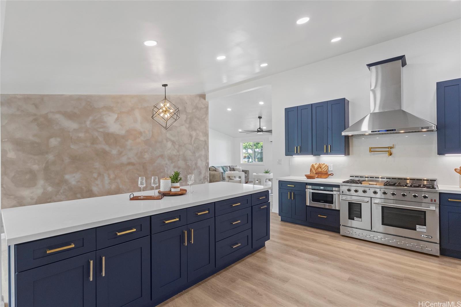 a kitchen with a stove sink and cabinets