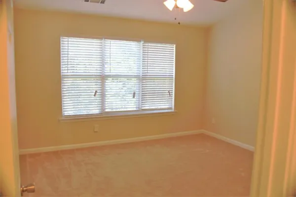 a stove top oven sitting inside of a kitchen