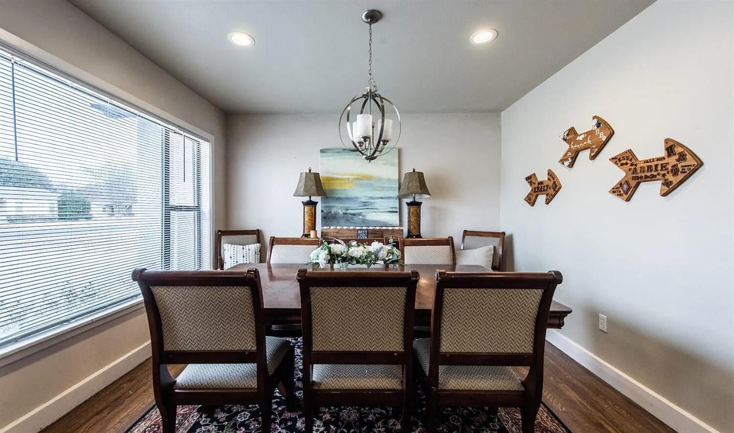 3105 29th Street Lubbock, TX 79410 - Photo 4 of 18 a dining room with furniture a chandelier and window