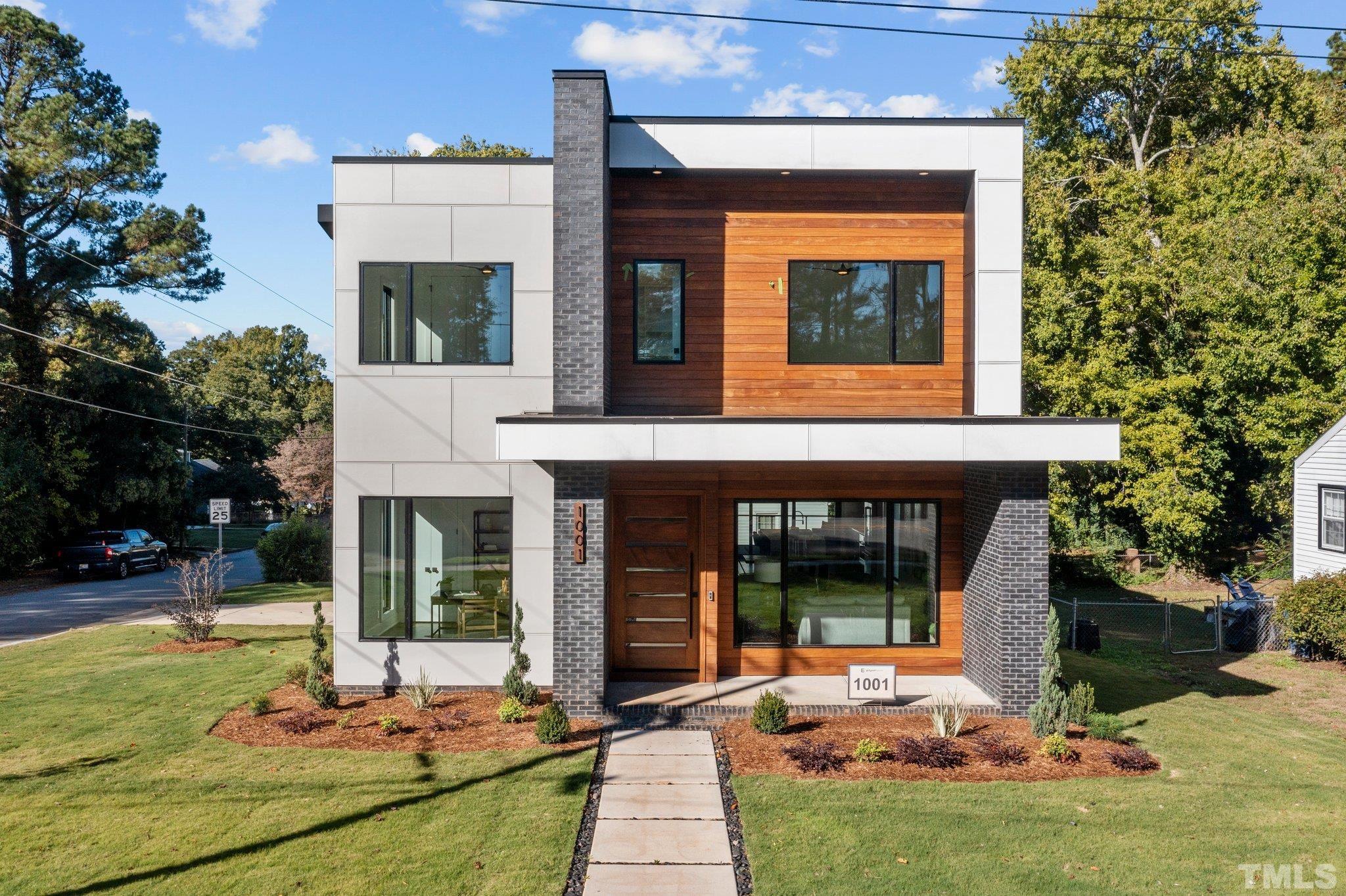 1001 North State Street Raleigh, NC 27604 - Photo 3 of 30 An architectural dream, this house will have modern home fanatics taking mental photos to savor for later. The Cumaru wood accented front elevation invites a warm, natural feel amidst to coolness of sleek, modern lines.