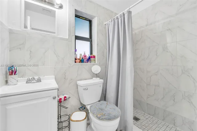 a bathroom with a toilet and a sink