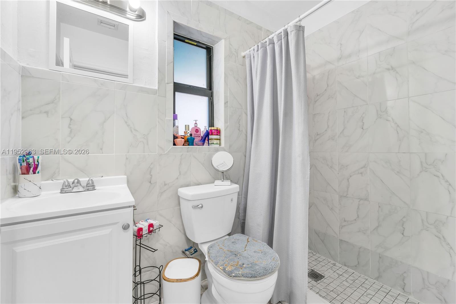 9 West 16th Street, Unit 9 Hialeah, FL 33010 - Photo 8 of 9 a bathroom with a toilet and a sink