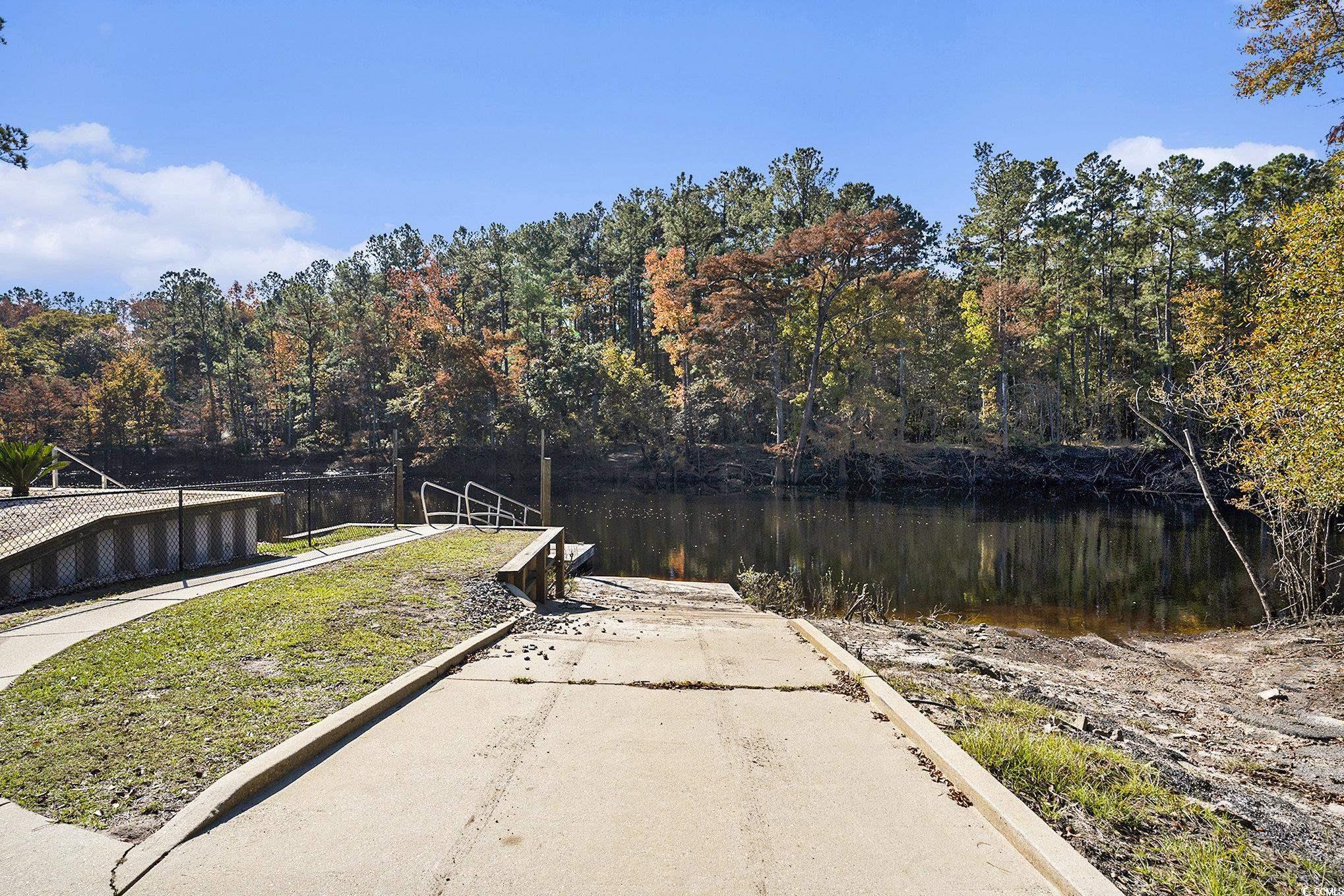 104 Lure Court Conway, SC 29526 - Photo 14 of 23 Dock with a boat ramp, a water view, and a forest view