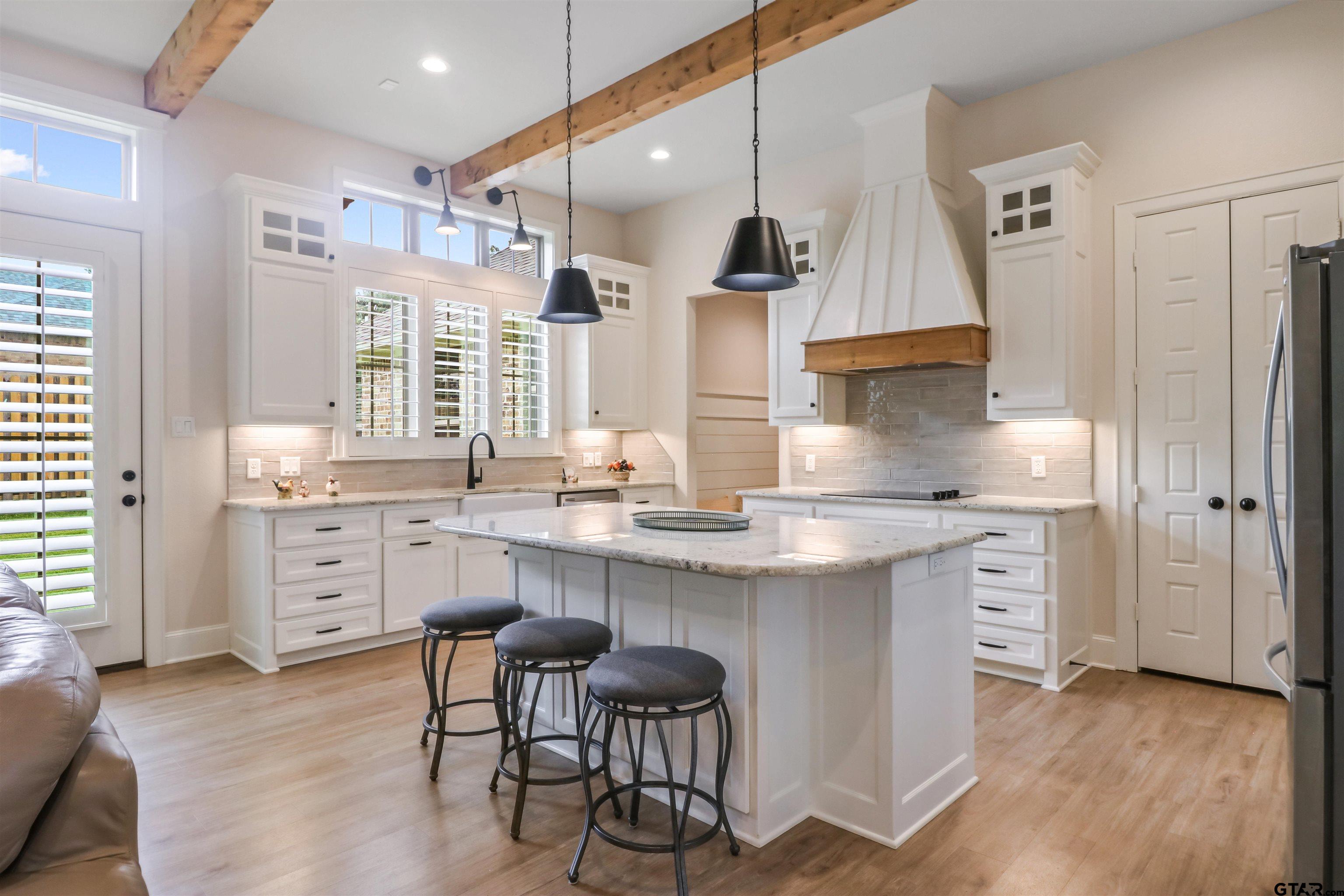 15733 County Road 1104 Flint, TX 75762 - Photo 13 of 32 a kitchen with white cabinets and sink