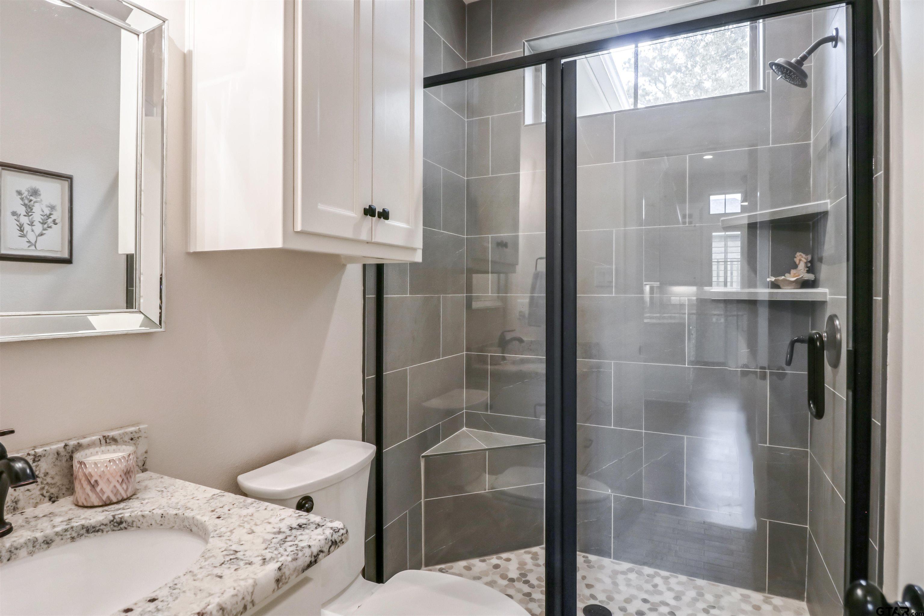 15733 County Road 1104 Flint, TX 75762 - Photo 18 of 32 a bathroom with a sink toilet and shower