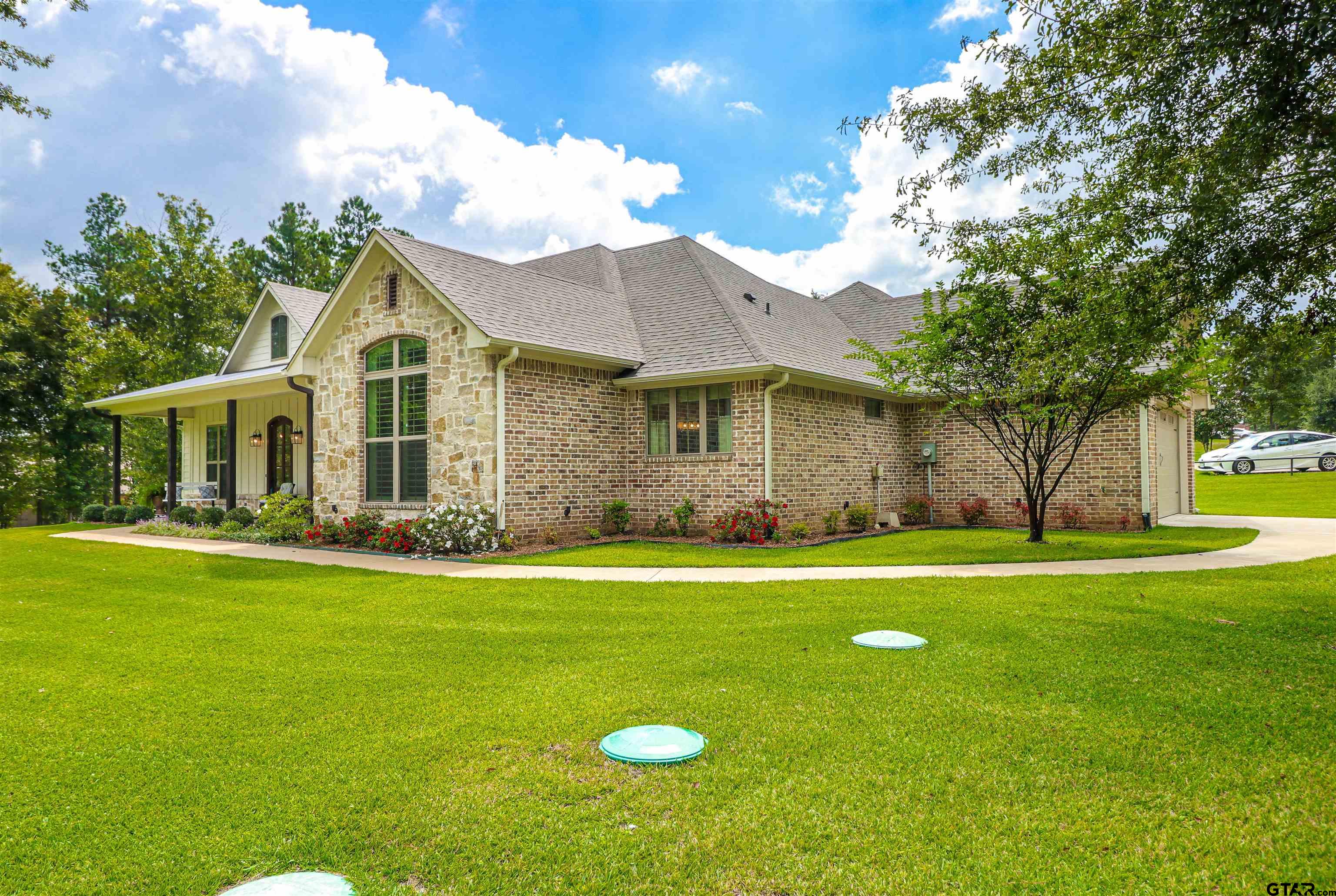 15733 County Road 1104 Flint, TX 75762 - Photo 3 of 32 a front view of a house with a garden