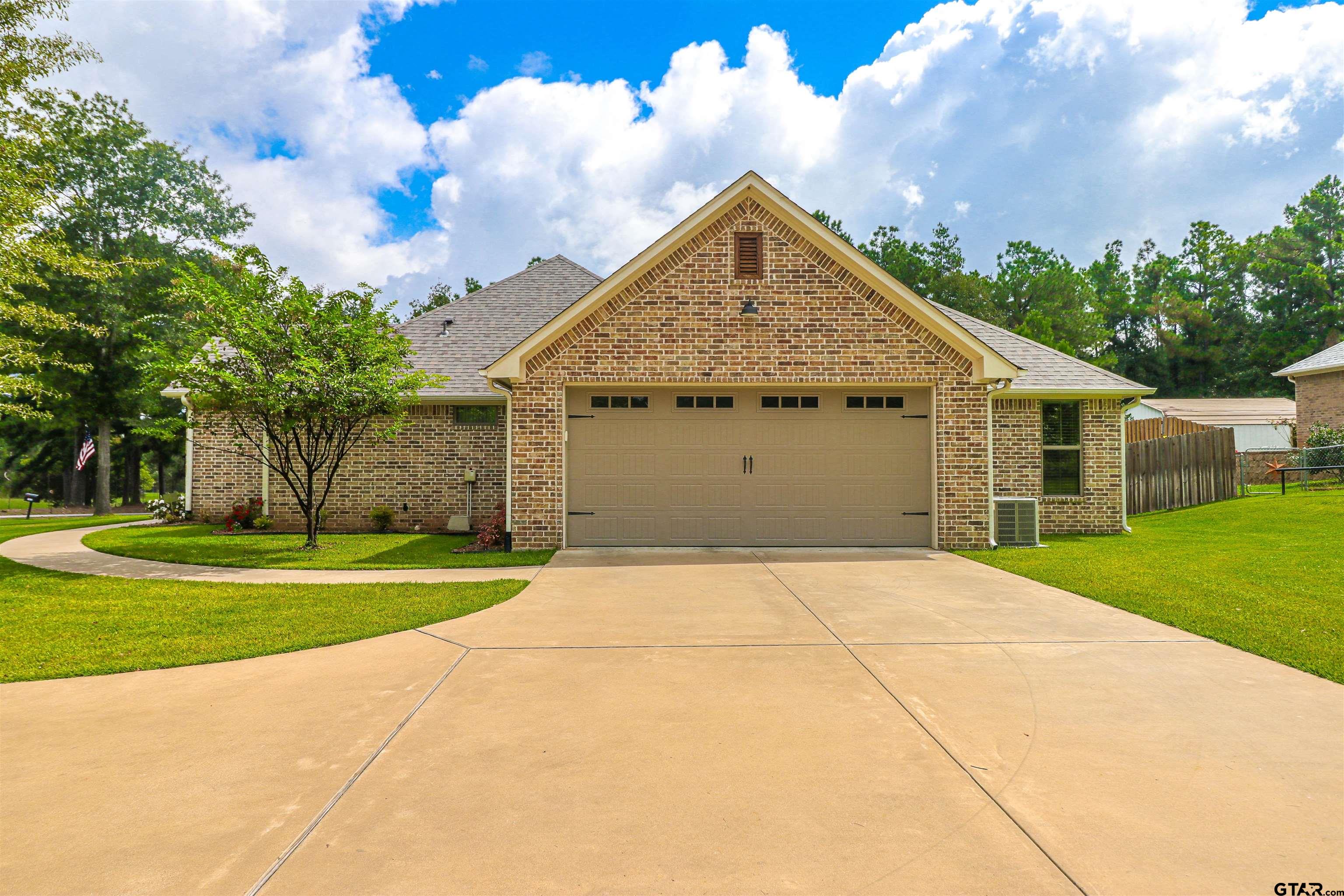 15733 County Road 1104 Flint, TX 75762 - Photo 4 of 32 a front view of a house with garden