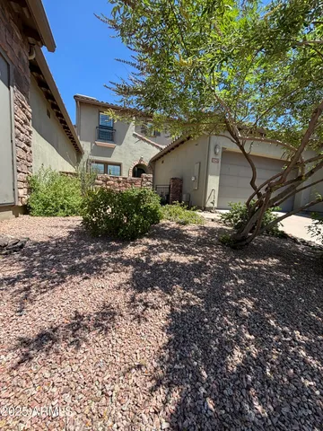 a house view with a backyard space