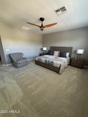 a bedroom with bed and window