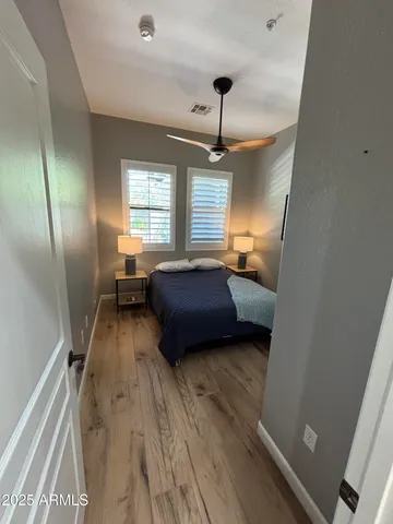 a bedroom with a bed and window